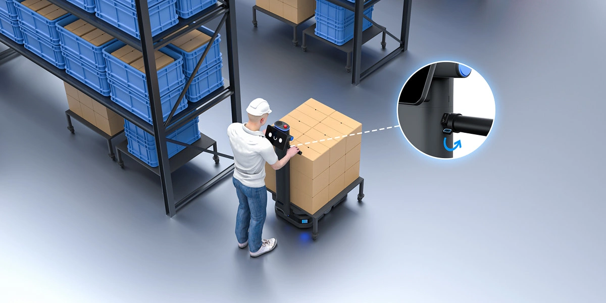 Mitarbeitender bedient den Griff-Assist-Schalter des T600
